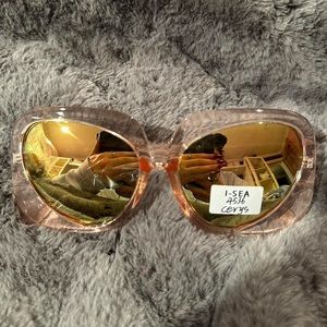 Unisex sunglasses translucent pink frame with metallic lens tinted yellow